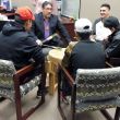 Elder Marcel Gagnon with youth performing on the Pow Wow drum for The Elders Justice Council and sta